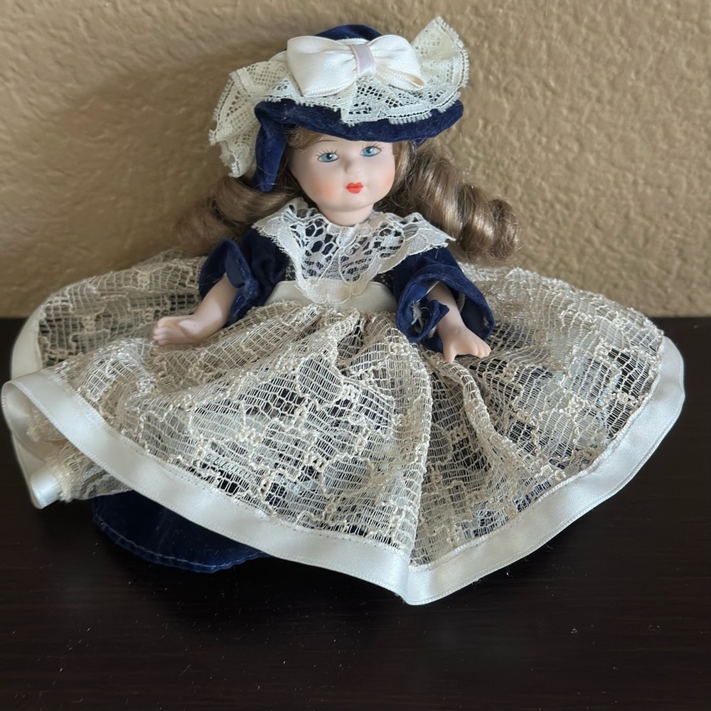 Vintage Porcelain Doll with Lace Dress and Hat Collectible